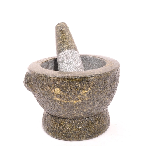 240 - A large volcanic rock style molcajete / pestle and mortar. Raised on a rounded base, with large bowl... 