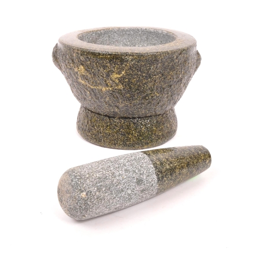 240 - A large volcanic rock style molcajete / pestle and mortar. Raised on a rounded base, with large bowl... 