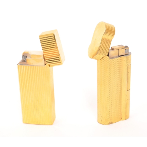 241 - Dunhill / Saffa - Two mid 20th century gold plated pocket cigarette lighters. Each lighter having an... 