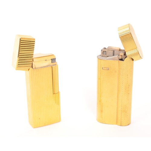 241 - Dunhill / Saffa - Two mid 20th century gold plated pocket cigarette lighters. Each lighter having an... 