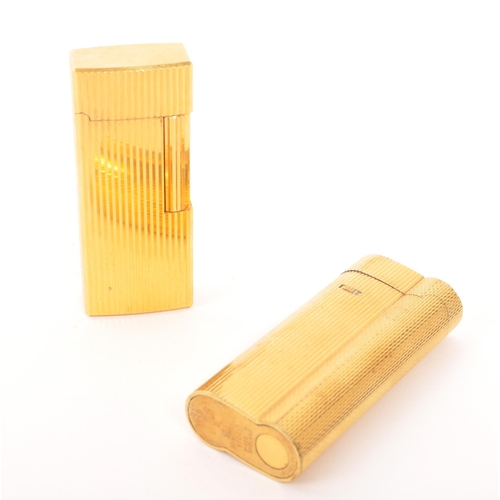 241 - Dunhill / Saffa - Two mid 20th century gold plated pocket cigarette lighters. Each lighter having an... 