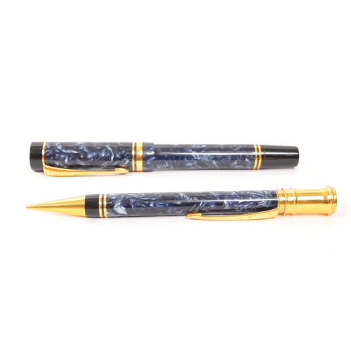 242 - Parker - A matching Parker DuoFold Centennial fountain pen and propelling pencil. Having marbled blu... 