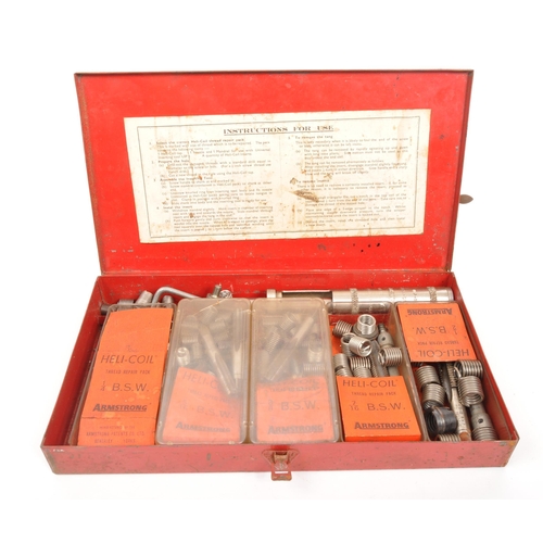 243 - A mid 20th century table lathe and Armstrong thread repair kit. The kit in original tin, with a larg... 