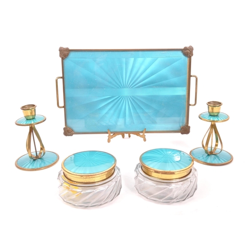 246 - An early 20th Century circa 1920s Art Deco dressing table set comprising of tray, two candlesticks, ... 