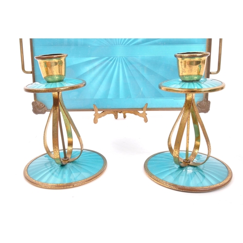 246 - An early 20th Century circa 1920s Art Deco dressing table set comprising of tray, two candlesticks, ... 