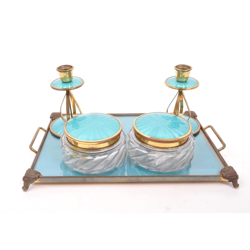 246 - An early 20th Century circa 1920s Art Deco dressing table set comprising of tray, two candlesticks, ... 