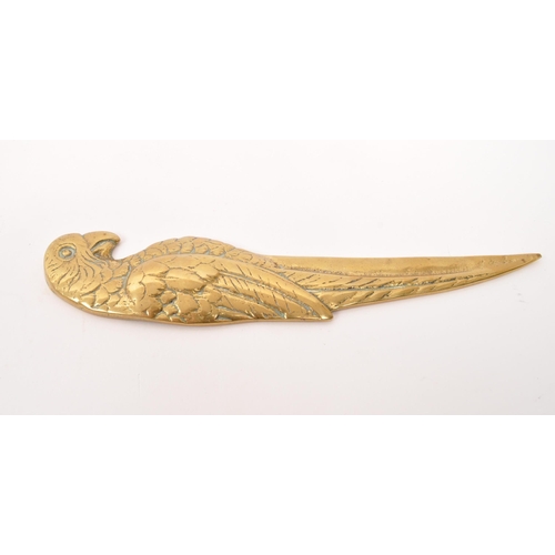 248 - A 20th Century vintage brass letter opener in the form of a parrot. Measuring approximately 19cm x 5... 