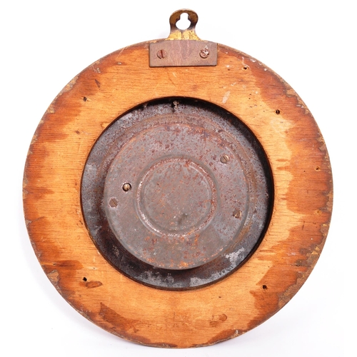 252 - A late 19th Century Victorian wall hanging aneroid barometer of circular form having engraved floral... 