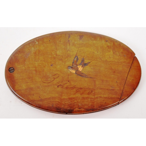 254 - An early 20th Century Edwardian walnut personalised handheld oval slide mirror having inlaid swallow... 