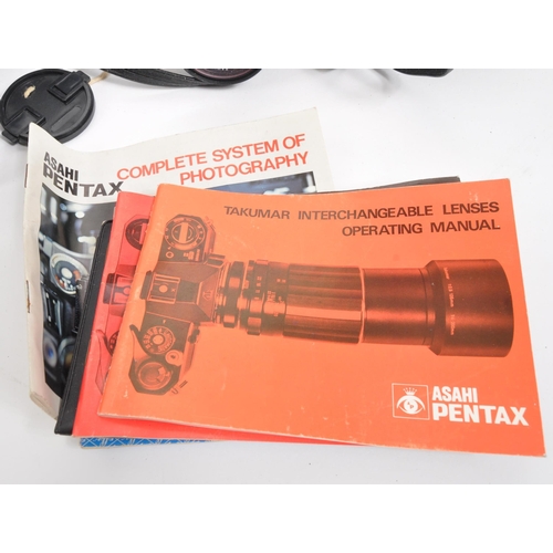 260 - Pentax - A collection of vintage 20th century Pentax SLR cameras, with accessories, lenses. With car... 