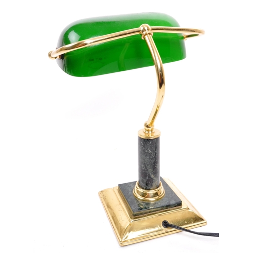 261 - A 20th Century vintage green bankers table top desk lamp light. With a green glass lightshade upon a... 