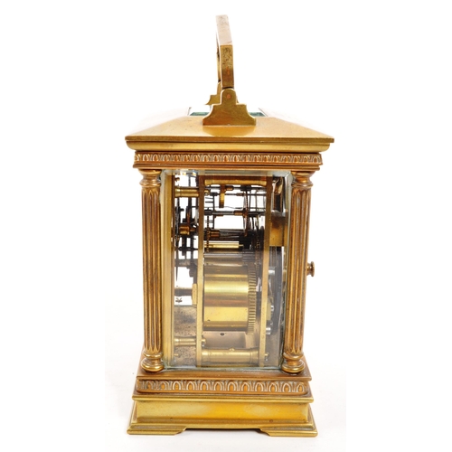 262 - An early 20th century brass carriage clock. With white face, ebonised chapter ring, with glass viewi... 