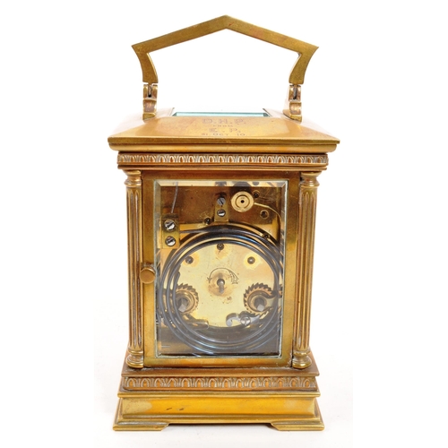 262 - An early 20th century brass carriage clock. With white face, ebonised chapter ring, with glass viewi... 