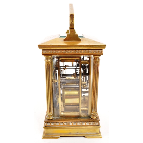 262 - An early 20th century brass carriage clock. With white face, ebonised chapter ring, with glass viewi... 