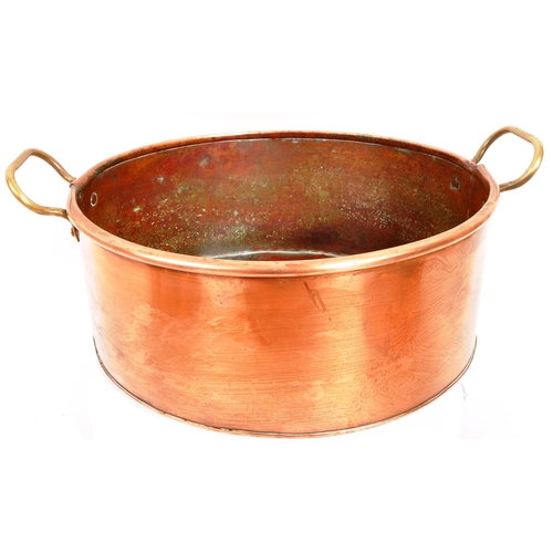 267 - A collection of four 20th Century vintage oval shaped graduating copper pans / planters having bras ... 