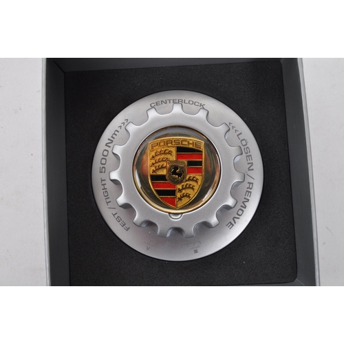 270 - A collection of 20th century Porsche Motors memorabilia items. The collection to include a Porsche b... 