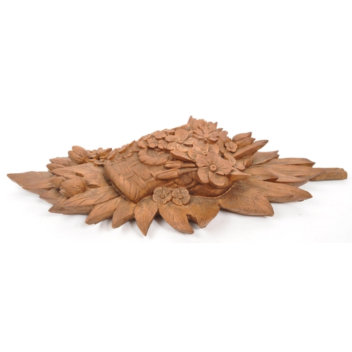 272 - A large 20th Century wood effect resin wall hanging display bouquet of flowers. Measuring approximat... 