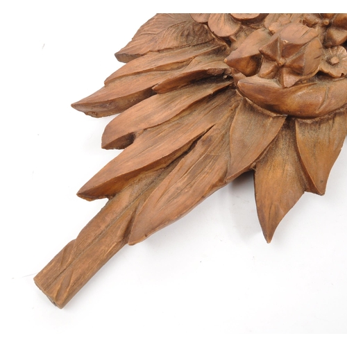 272 - A large 20th Century wood effect resin wall hanging display bouquet of flowers. Measuring approximat... 