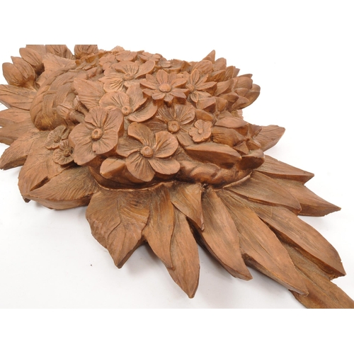 272 - A large 20th Century wood effect resin wall hanging display bouquet of flowers. Measuring approximat... 