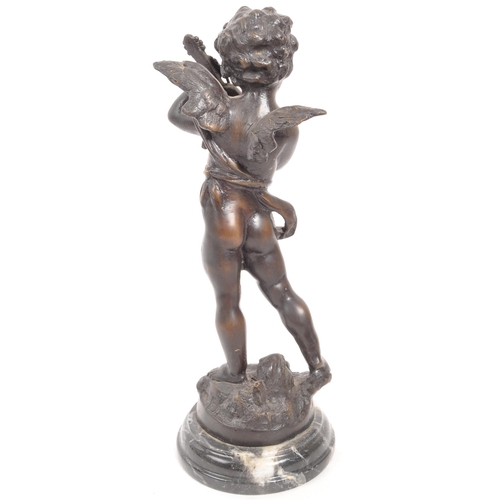 274 - A reproduction bronze figure in the form of a cherub / putti playing the violin, raised on a circula... 