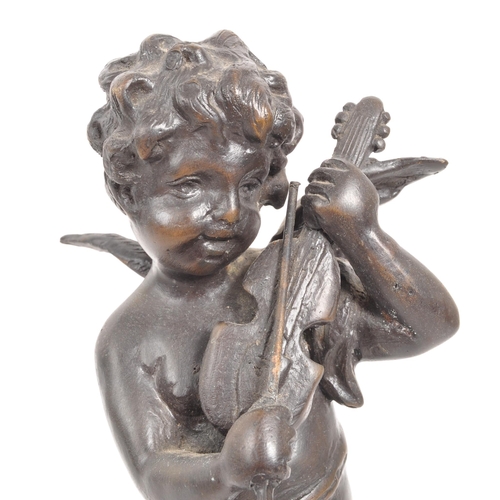 274 - A reproduction bronze figure in the form of a cherub / putti playing the violin, raised on a circula... 