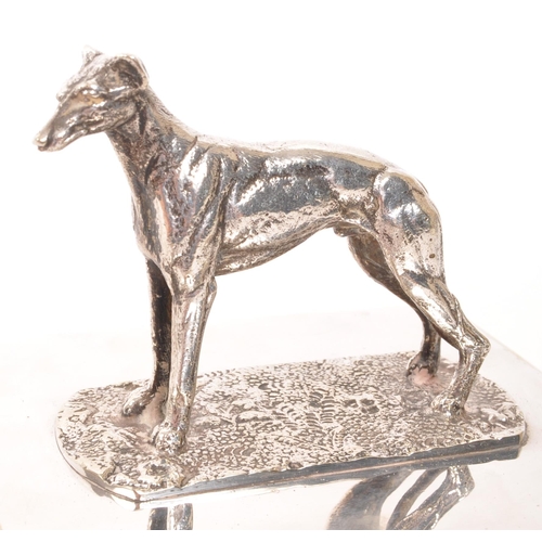 276 - A vintage 20th century greyhound top silver plate cigarette holder. With greyhound dog to top, on re... 