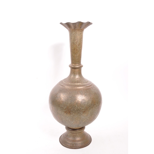 282 - A large 20th century brass Benares vase. The vase raised on a rounded base with bulbous body, and fl... 