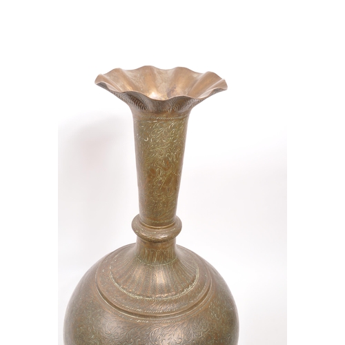 282 - A large 20th century brass Benares vase. The vase raised on a rounded base with bulbous body, and fl... 