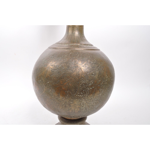 282 - A large 20th century brass Benares vase. The vase raised on a rounded base with bulbous body, and fl... 