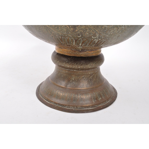 282 - A large 20th century brass Benares vase. The vase raised on a rounded base with bulbous body, and fl... 