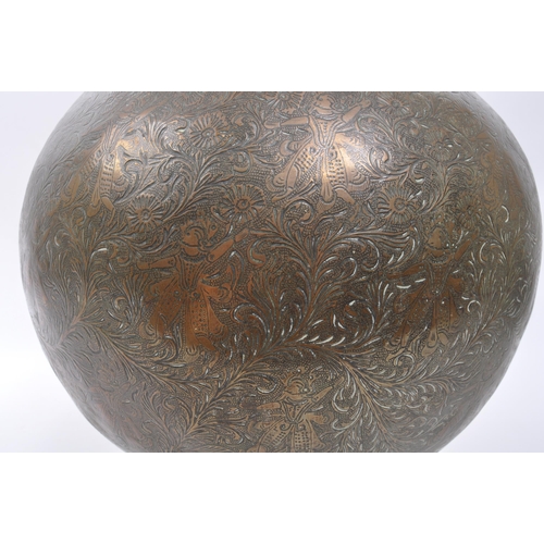 282 - A large 20th century brass Benares vase. The vase raised on a rounded base with bulbous body, and fl... 