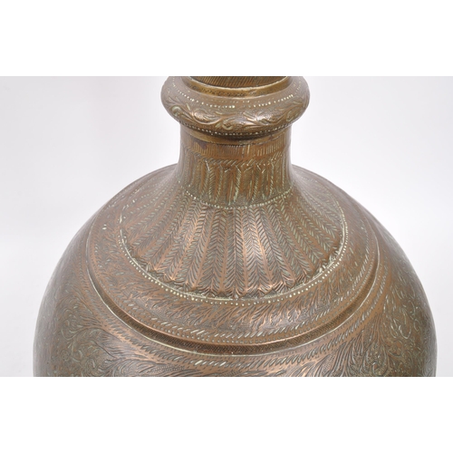 282 - A large 20th century brass Benares vase. The vase raised on a rounded base with bulbous body, and fl... 