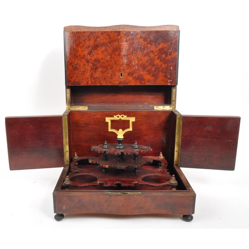 283 - An early 20th Century mahogany bell tantalus drinks box with four decanter lift out fitted interior.... 