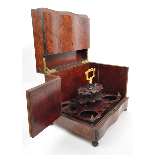 283 - An early 20th Century mahogany bell tantalus drinks box with four decanter lift out fitted interior.... 