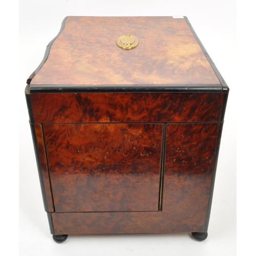 283 - An early 20th Century mahogany bell tantalus drinks box with four decanter lift out fitted interior.... 