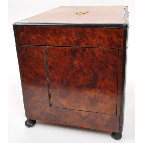 283 - An early 20th Century mahogany bell tantalus drinks box with four decanter lift out fitted interior.... 