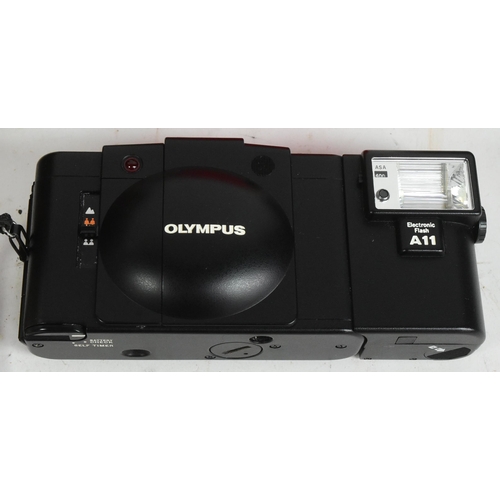 292 - Olympus - A late 20th century Olympus XA2 XA range 35mm viewfinder scale focusing compact camera and... 