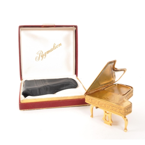 293 - Pygmalion - A mid Century circa 1950s git metal Pygmalion musical powder compact case in the form of... 