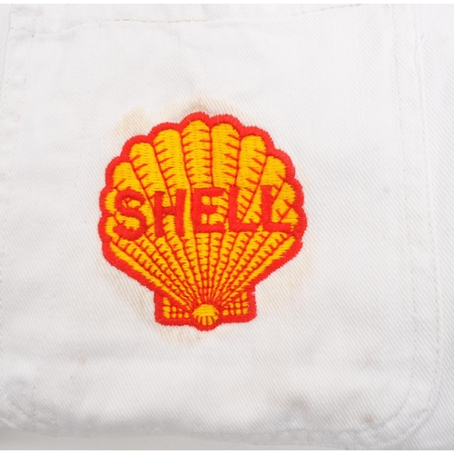 296 - Shell Oil - Two 20th century Shell Oil petrol station forecourt / workshop jackets / coats. One bein... 