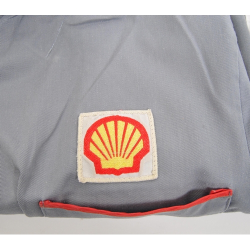 296 - Shell Oil - Two 20th century Shell Oil petrol station forecourt / workshop jackets / coats. One bein... 