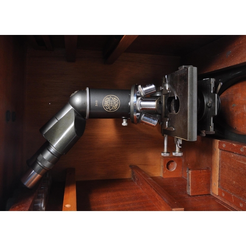 299 - C Baker London - A C. Baker London microscope and light model number 2210 held within wooden carry c... 