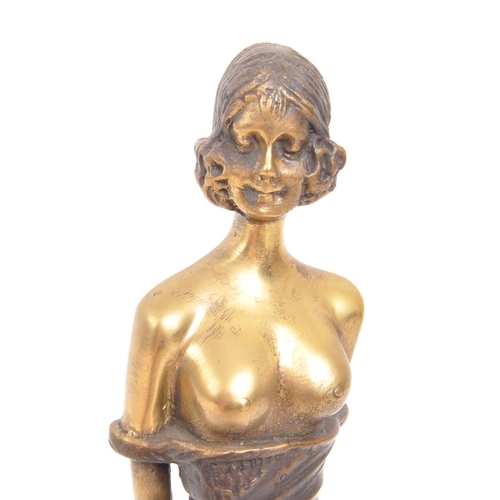 302 - An Art Deco vintage 20th century circa 1940s brass semi nude female figure. Standing position, holdi... 