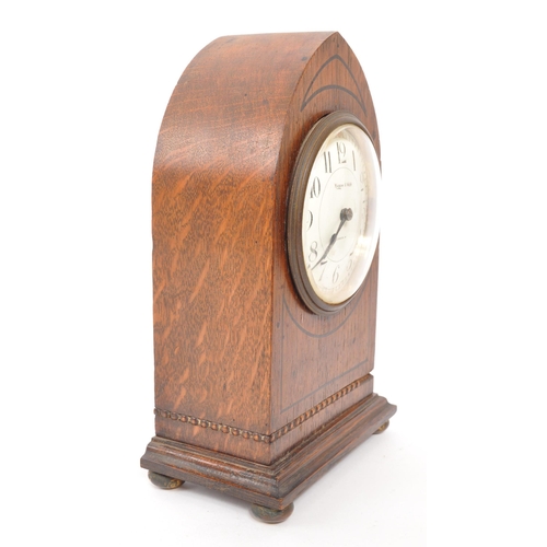 306 - Mappin & Webb - A mid Century circa 1950s oak Mappin & Webb mantel clock having a three pointed arch... 