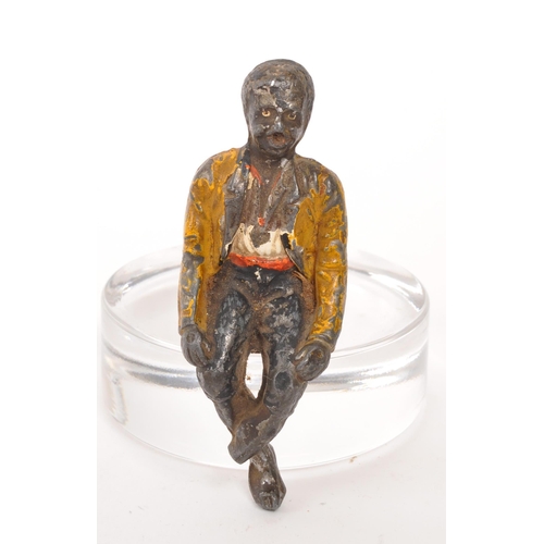 309 - A late 19th Century cold painted bronze cork drinks stopper in the form of a sitting figure. Measuri... 