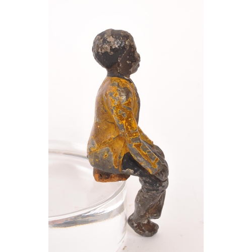 309 - A late 19th Century cold painted bronze cork drinks stopper in the form of a sitting figure. Measuri... 