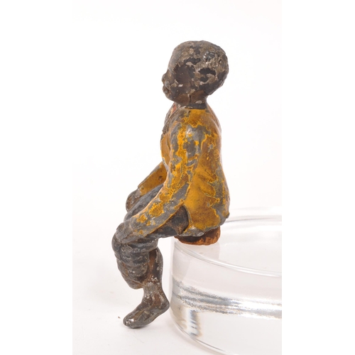 309 - A late 19th Century cold painted bronze cork drinks stopper in the form of a sitting figure. Measuri... 