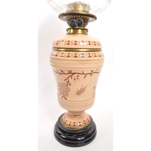 310 - Hinks & Sons - A 19th Century Victorian ceramic Aestheticism oil lamp by Hinks & Sons. Having a beig... 