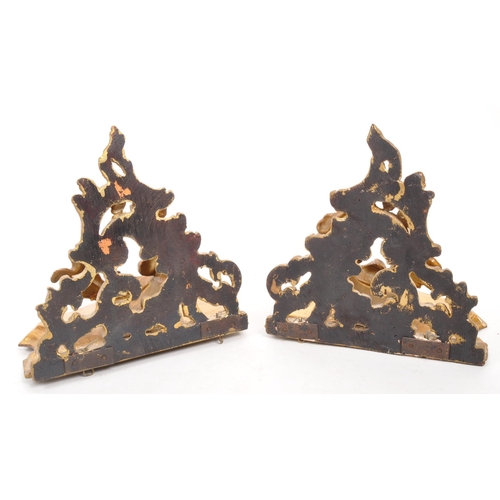 317 - A pair of 19th Century wooden gilt painted hall sconces / shelves. Having acanthus style foliate to ... 