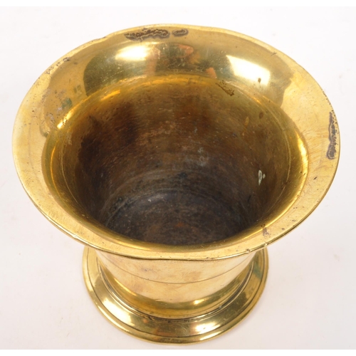 319 - A vintage 20th brass pestle and mortar. With a baluster shaped pestle and tapering circular mortar. ... 