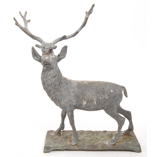 323 - A vintage 20th century cast bronze stag deer. With antler in a standing position on a base with rack... 